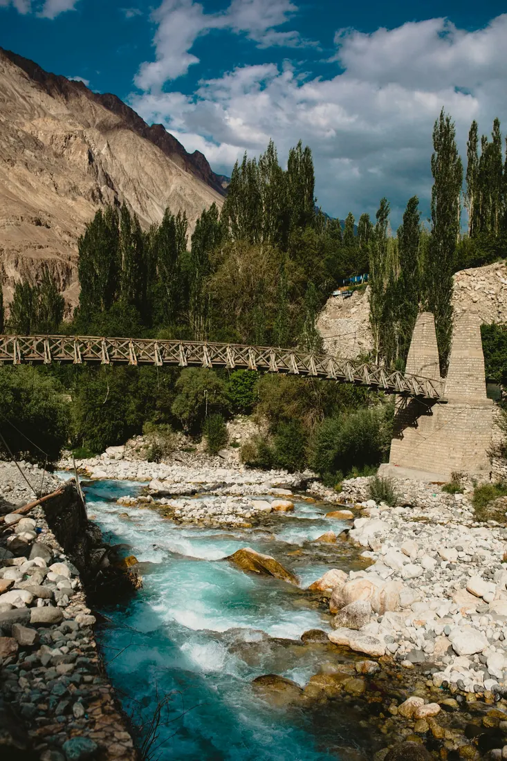 Wooden bridge over a glacial river in Ladakh